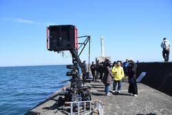 写真：阿漕浦海岸堤防でのロケの様子5