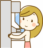 乳がん検診マンモグラフィ検査を受ける女性のイラスト